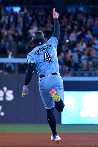 Springer hits two homers as Blue Jays top Athletics but lose Varsho to leg injury