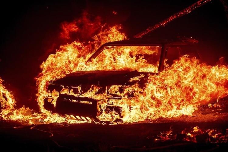 Firefighters get some help from cooler temperatures after California's largest wildfire explodes