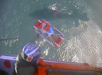 5 boaters found clinging to a cooler in Lake Erie are rescued by a Coast Guard helicopter crew