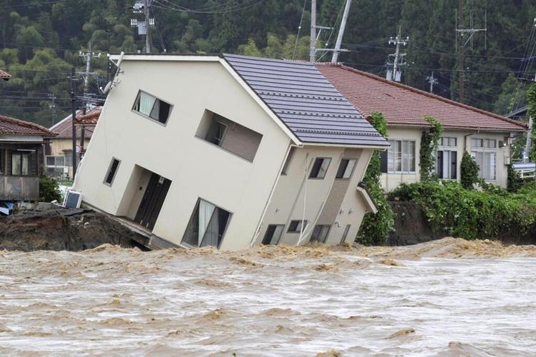 Rescue workers search for at least 6 people missing after heavy rain pounds Japan’s Noto region