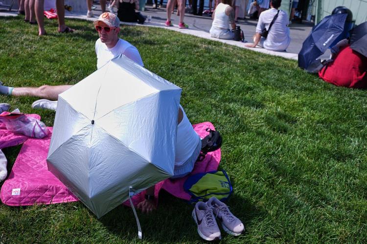 Searing heat and storms mar holiday with 3 children dead in Wisconsin and utility outages widespread