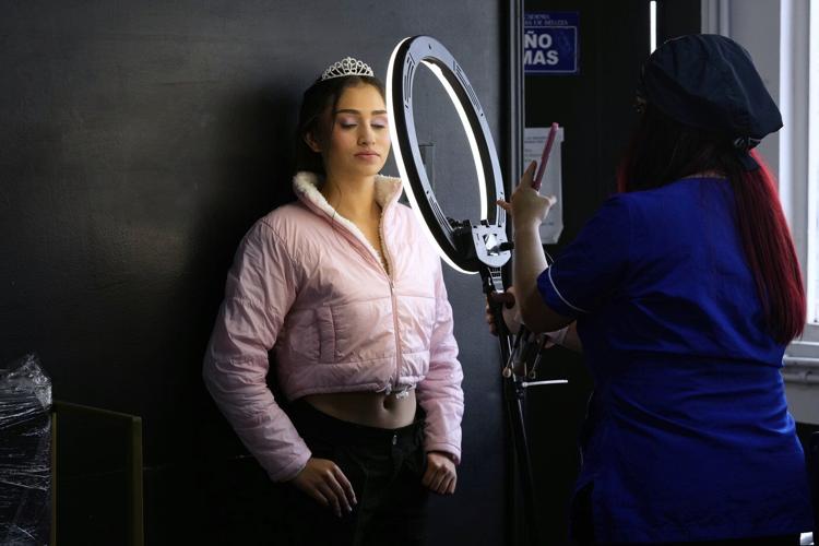 AP PHOTOS: Colombian quinceañeras see dream come true with the support of many, including the police