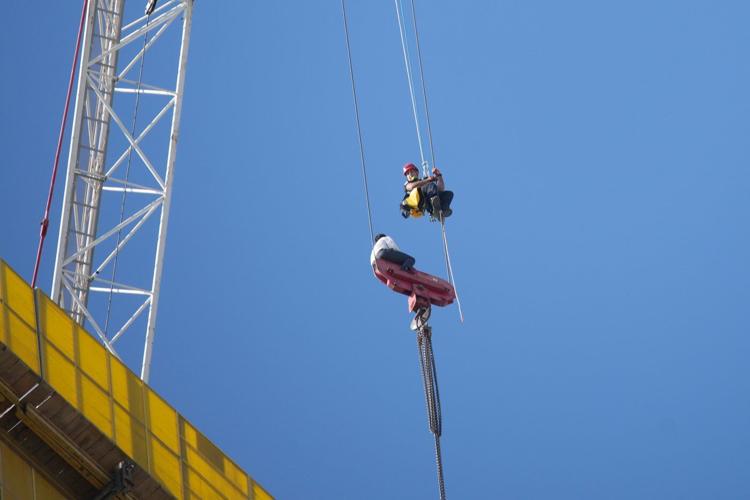 Fire teams rescue 15-year-old stuck on crane over high-rise building in Jerusalem