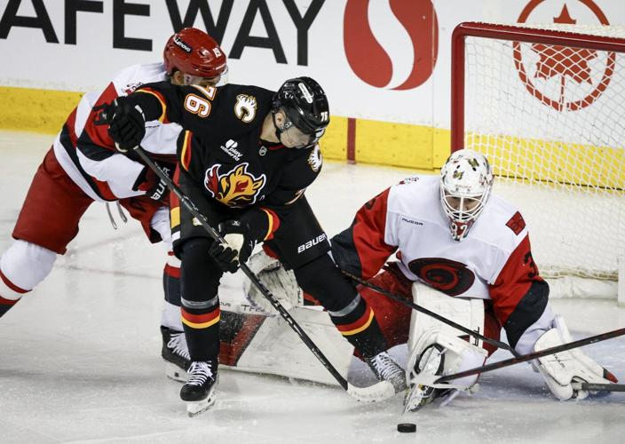 Farabee leads Flames to 5-4 win over Hurricanes