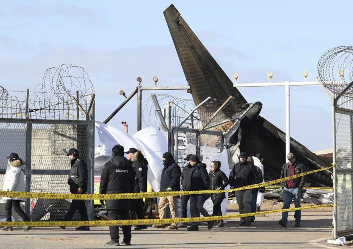 US and Boeing investigators examine the site of a deadly South Korean plane crash