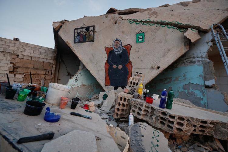 Syrian artists transform bombed-out house into a mural of remembrance, in photos