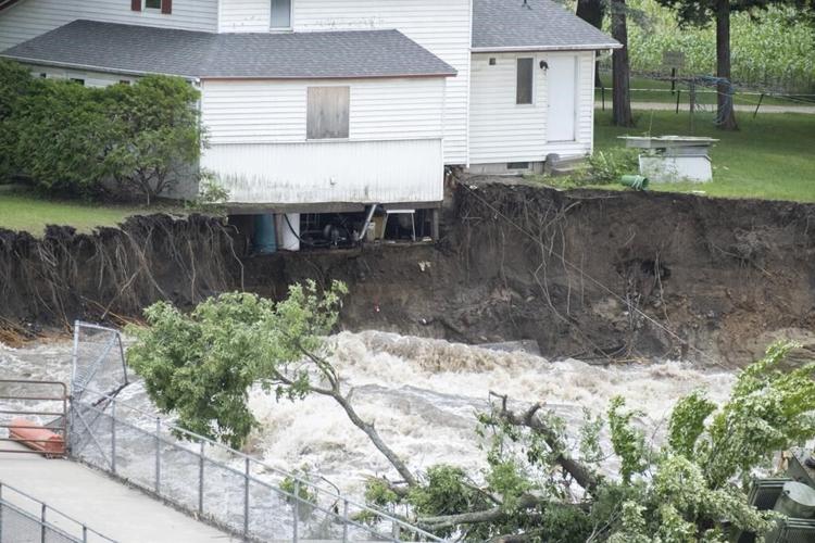 Minnesota family store is demolished from its perch near dam damaged by surging river