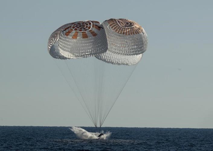 SpaceX ferries astronauts back to Earth after half-year away