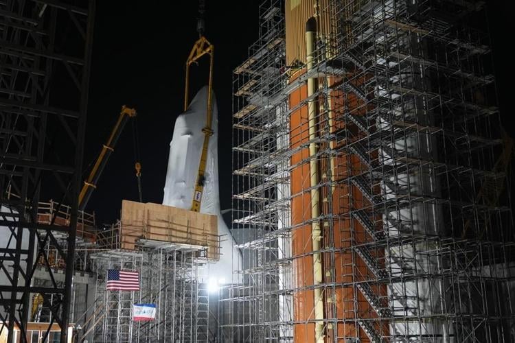 Space Shuttle Endeavour hoisted for installation in vertical display at Los Angeles science museum