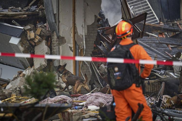 Rescuers search for victims after an explosion at a Dutch apartment block that killed at least 5
