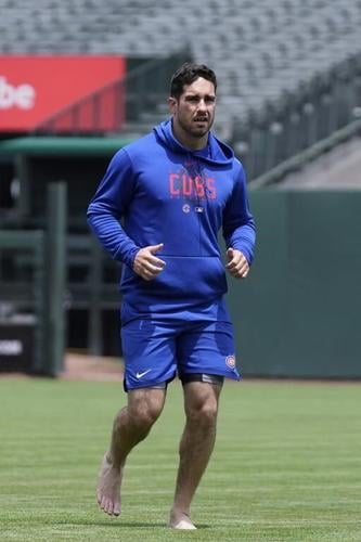 Baseball players are staying mindful on the diamond with barefoot walks in the grass