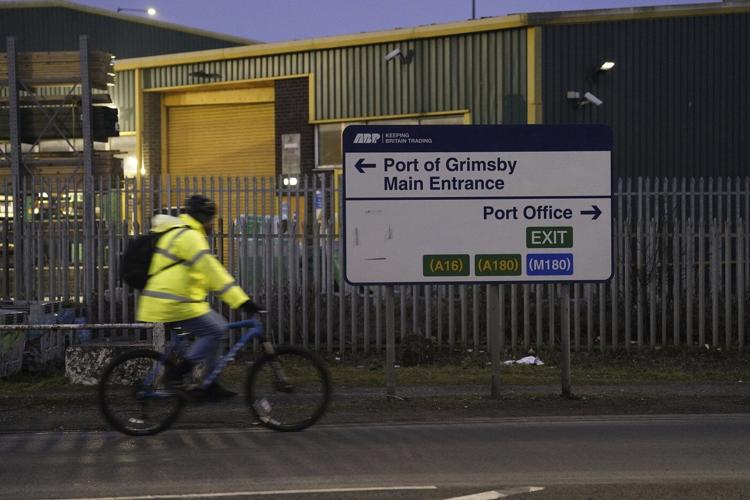 A cargo ship hits a tanker and they catch fire off England, with one crew member missing