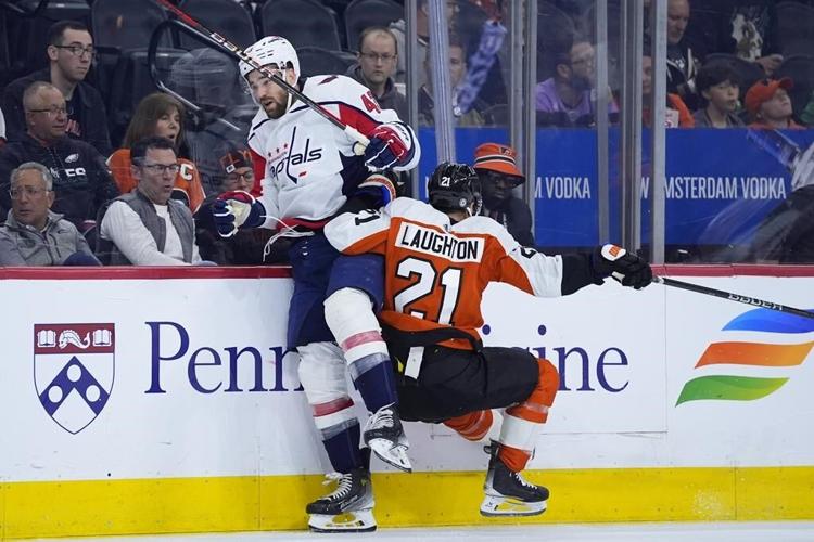 Oshie scores winner into empty net, Capitals make playoffs by beating Flyers