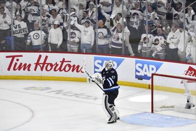 Hellebuyck gets run support, posts shutout in must-win Game 5 for Jets