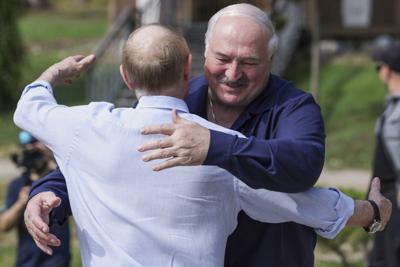 Belarus targets dozens of government critics with raids and detention, advocates say