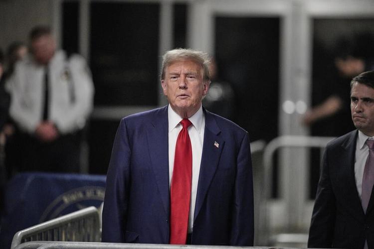 Trump returns to his campaign facing a warning of jail time if he violates a trial gag order
