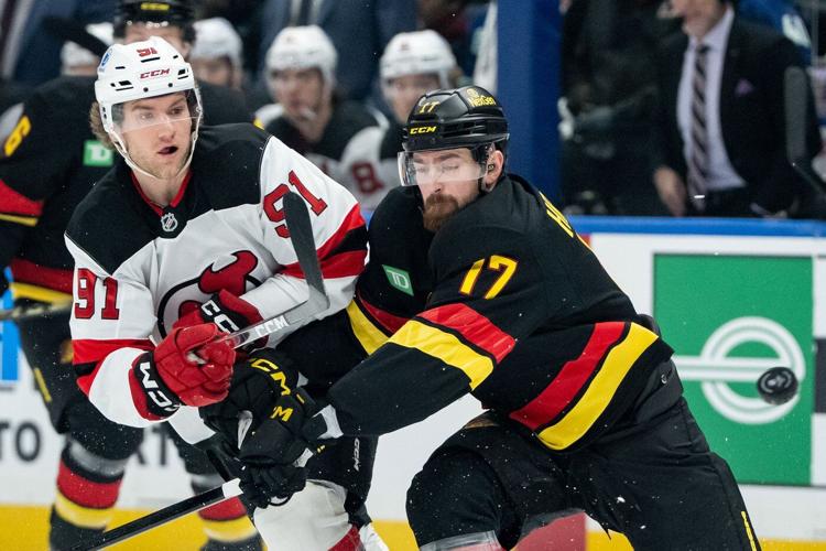 Glass scores twice as New Jersey Devils capture 5-4 victory over Vancouver Canucks