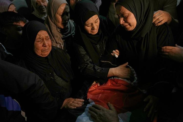 Israel hands over bodies of 45 Palestinians after Hamas returns the remains of 3 soldiers