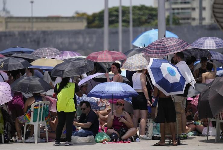 Taylor Swift postpones Rio de Janeiro show, citing record heat a day after fan dies during concert