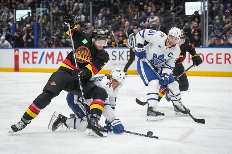 Late power-play goals lead Canucks past Leafs 6-4
