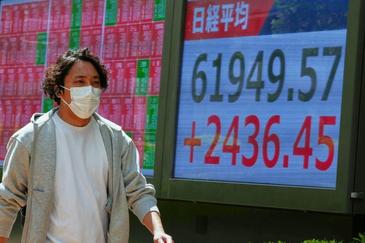 Hopes for reopening the Strait of Hormuz push Asian shares higher, as oil prices hold above $100