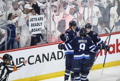 Connor's late goal fuels Jets to 5-3 win over Blues in playoff opener