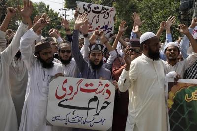 Death toll from Pakistan bombing rises to 54 as suspicion falls on local Islamic State group chapter