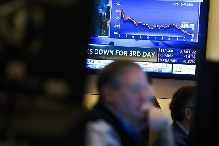 Stocks fall after Fed says it's too soon to pause rate hikes