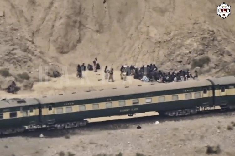 Pakistan says insurgents who attacked a passenger train killed 21 hostages while all others freed