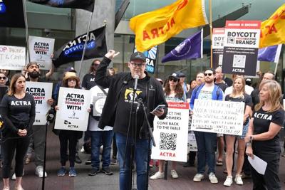 Steps from TIFF, striking actors, writers rally at ��ɫtv offices for Apple, Amazon