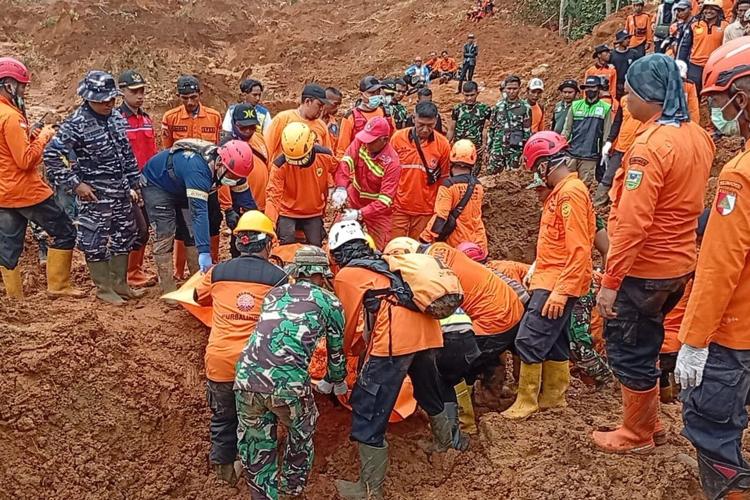 Indonesian rescuers search for nearly three dozen people after landslides killed at least 18 people