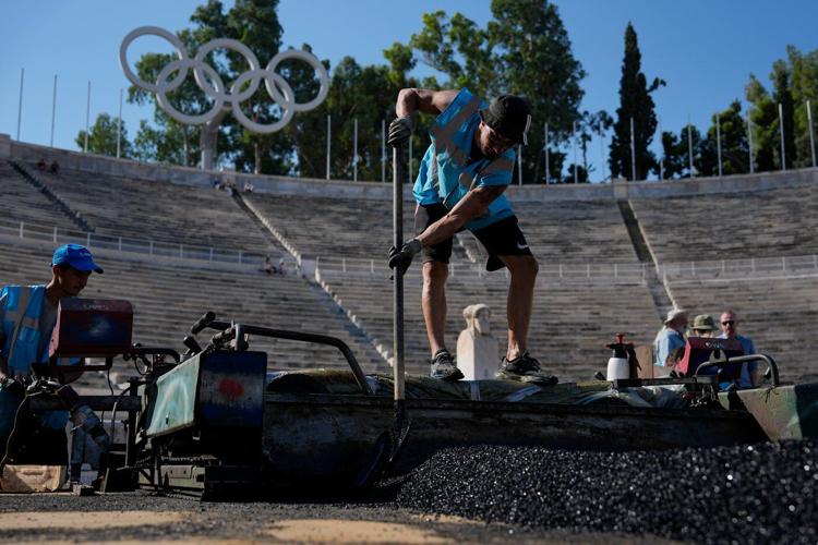 Athens is cleaning its all-marble Olympic stadium for the first time in more than a century