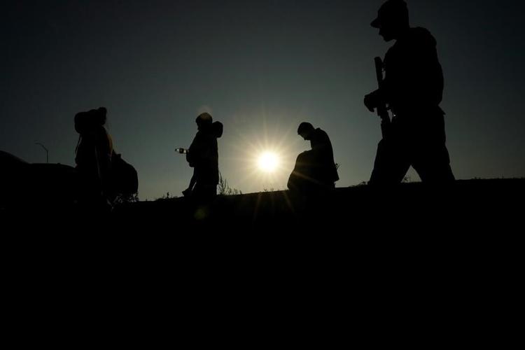 As migrants overwhelm a Texas border city, others wait in Mexico for appointments to enter the US