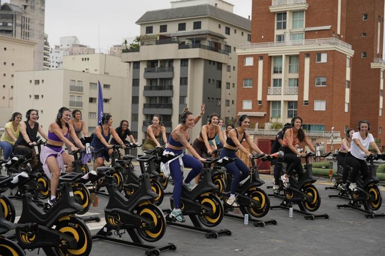 Up, up and spinning away. More Brazilians taking outdoor spin classes on helipads