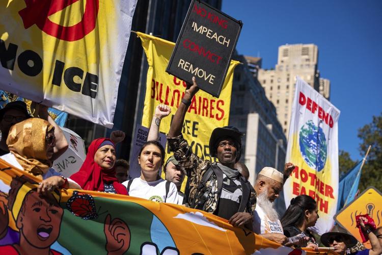 Photos show activists targeting billionaires in a street protest on the eve of New York Climate Week
