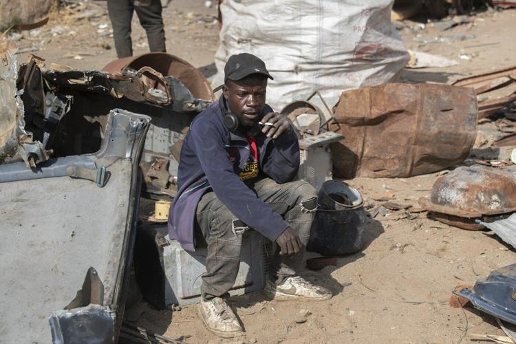 Zimbabwe's scrap metal hunters are quietly fighting climate change one piece at a time