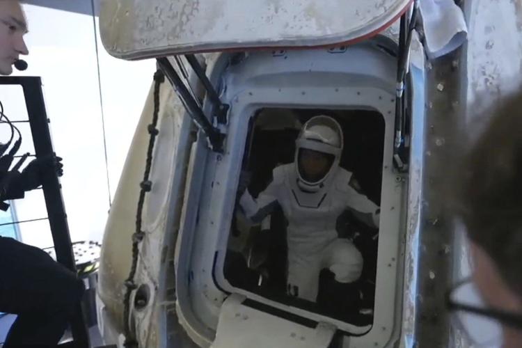 Four space tourists return to Earth after a private flight over the poles