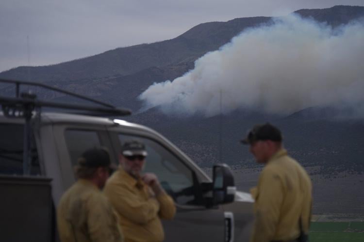 Dangerous weather hampers firefighters and leads to fireworks bans in western US