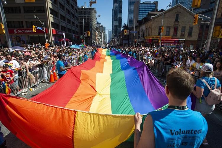 Large crowds pack Toronto streets as Canada's largest Pride parade begins