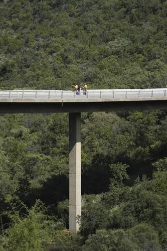 Investigators search for bodies of Easter pilgrims in bus that crashed off a bridge in South Africa