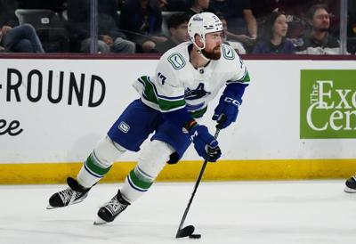 Vancouver Canucks sign defenceman Hronek to eight-year extension