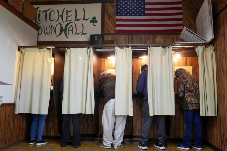 Justice Department's early moves on voting and elections signal a shift from its traditional role