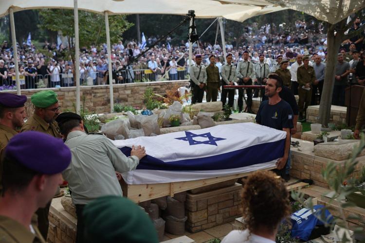 Tens of thousands attend funeral of Israeli soldier whose remains were held in Gaza for 11 years