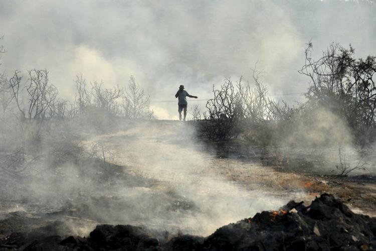 Cyprus gets help from other countries in battling huge wildfire that has killed 2