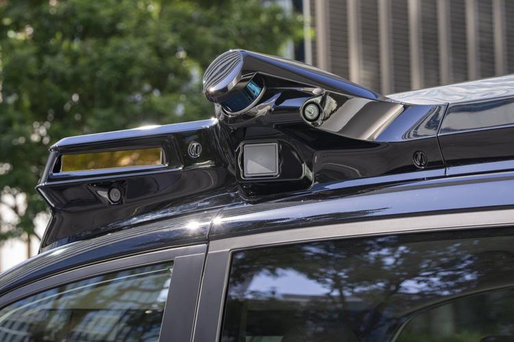 Japan's Nissan tests driverless vehicles in city streets filled with cars and people