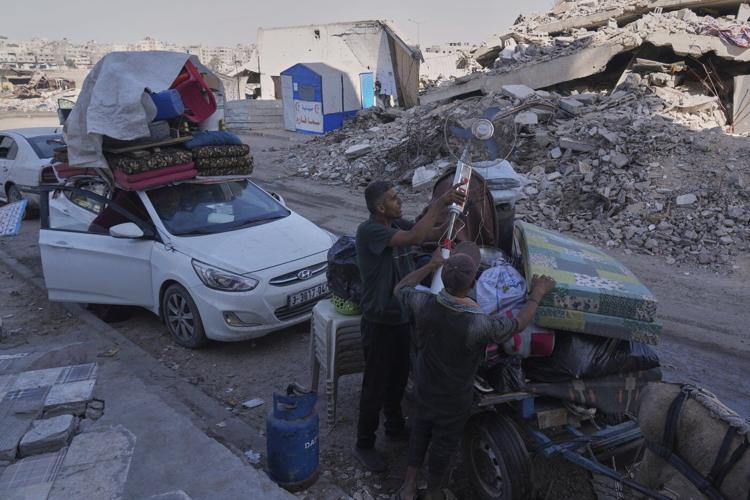 The Latest: Israel says bodies of 2 hostages returned as military begins Gaza City offensive