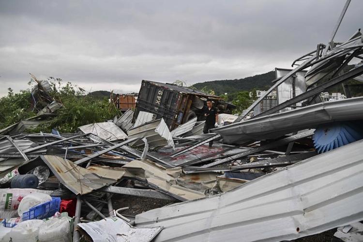 Aerial photos show wide devastation left by a deadly tornado in China's Guangzhou