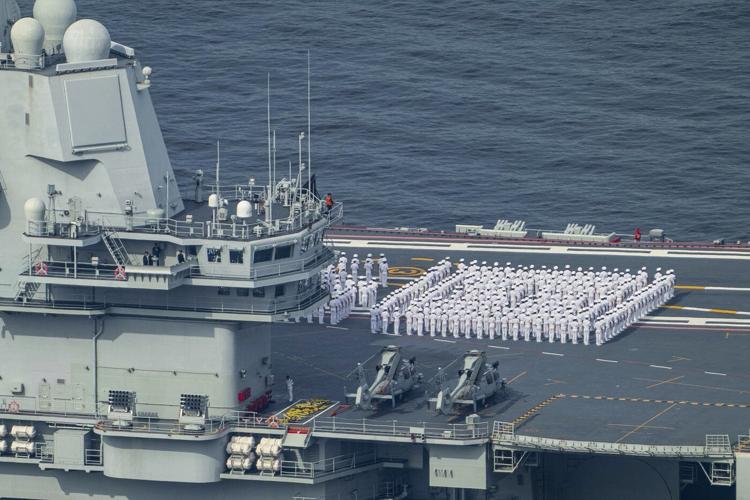 Chinese aircraft carrier sails into Hong Kong to boost patriotism