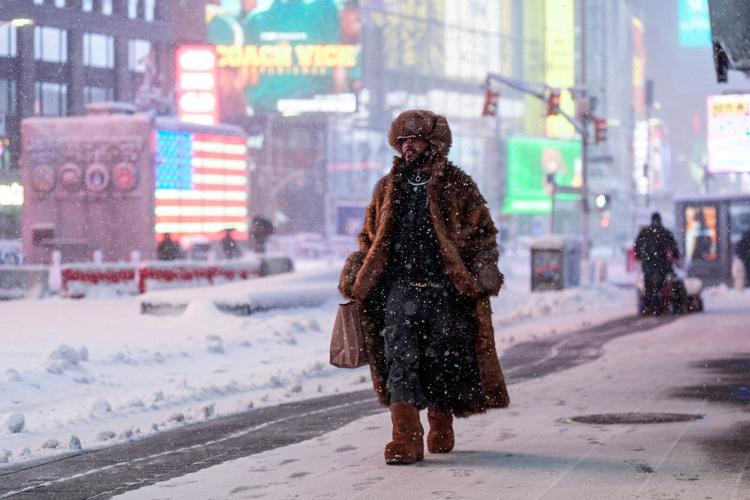Northeast US digs out from brutal snowstorm that disrupted flights and canceled school