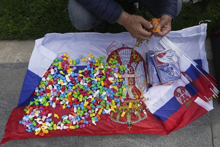 Thousands rally in Serbia's capital demanding snap elections after months of protests